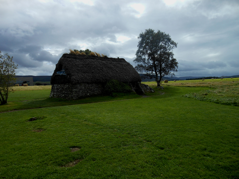 Culloden Old Leanach cottage surrounded by haystacks © 2012 Scotiana