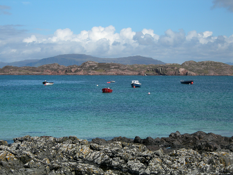Blue waters and colourful boats on Iona island © 2006 Scotiana